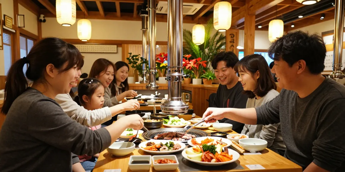 Delicious Korean BBQ meal at 상봉동 한국관 surrounded by friends in a cozy restaurant